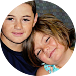 Two children smiling supported by Give Hope Nevada