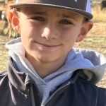 Young boy smiling supported by Give Hope Nevada program